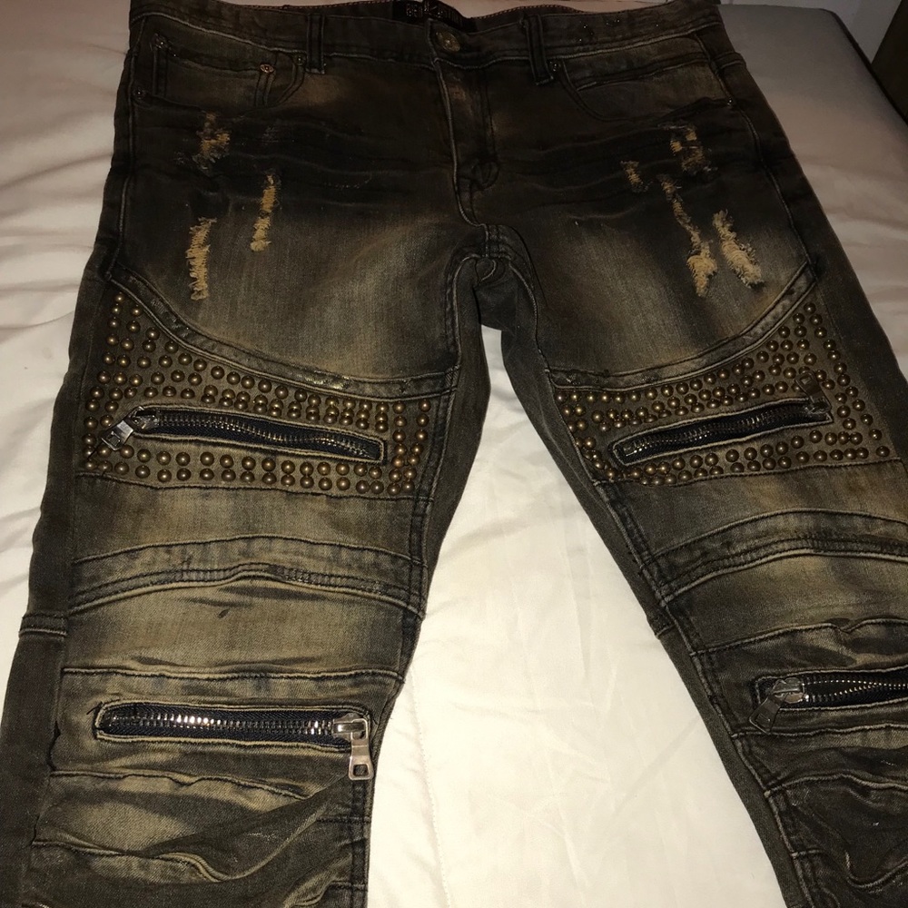 Blue Jean Pants With A Little Tan On Them